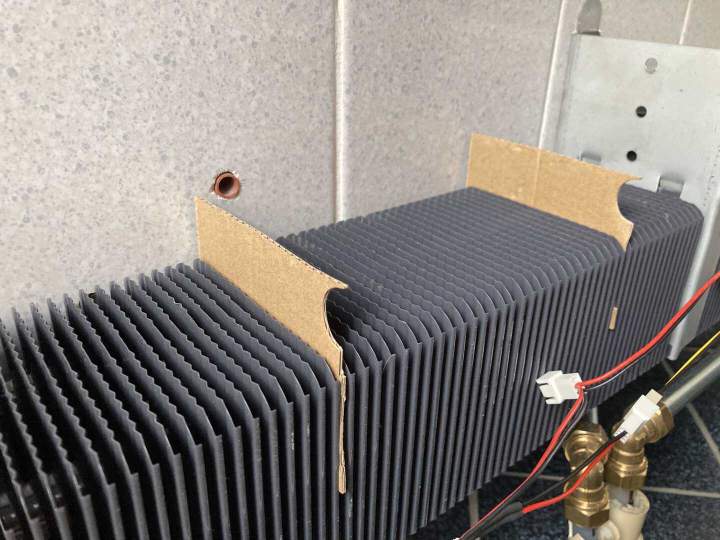 Cut cardboard to shape, place in between radiator grill blades